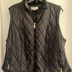 Black quilted vest with gold details